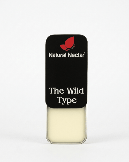 Natural Nectar The Wild Type Amber Marine Solid Perfume tin in lifestyle shot with marine-inspired styling.