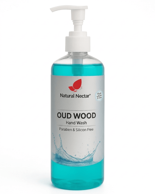 Natural Nectar Oud Wood Hand Wash in a clear plastic pump bottle with turquoise liquid visible inside on a white background.