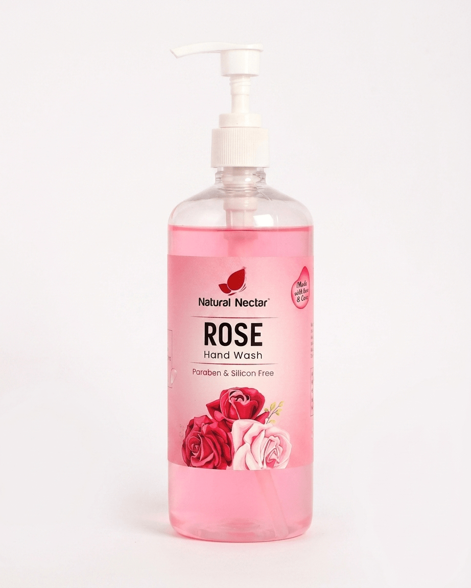 Natural Nectar Rose Hand Wash in a clear plastic pump bottle with pink liquid visible inside on a pale background.