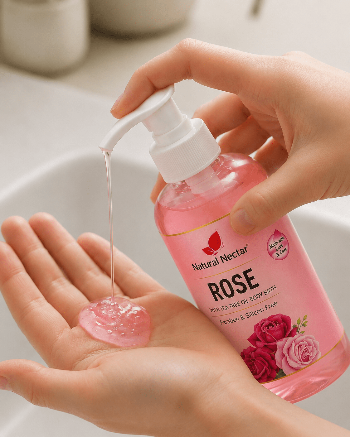A person's hands being washed under flowing water, demonstrating Natural Nectar Rose Hand Wash in use.