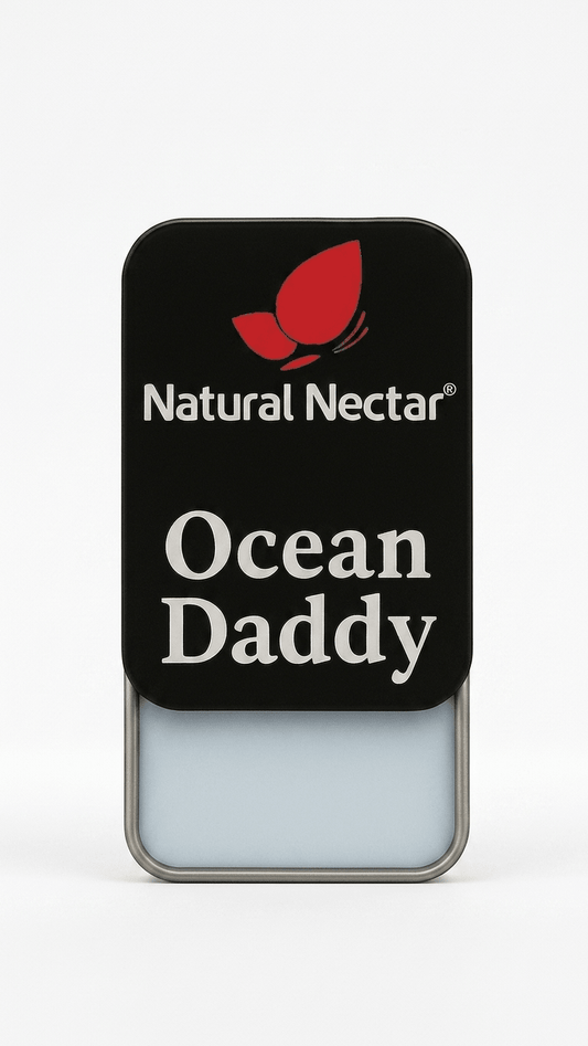 Natural Nectar Ocean Daddy Woody Musk Solid Perfume tin in lifestyle shot with musk-inspired styling.