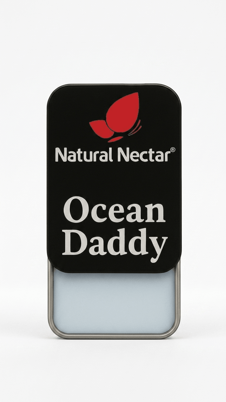 Natural Nectar Ocean Daddy Woody Musk Solid Perfume tin in lifestyle shot with musk-inspired styling.